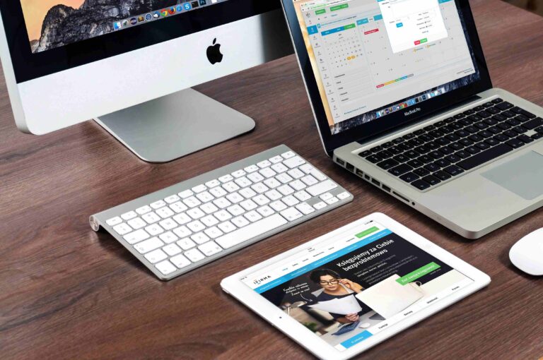 Desktop computer, laptop, and tablet used for professional web design